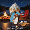 Glass of iced coffee with whipped cream, outdoor campfire, lake, and s'mores ingredients.