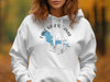 White hoodie with "Lake Kabetogama Minnesota" and a compass design.
