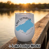 White stemless wine tumbler with a blue map of Lake Quinault, Washington, sitting on a wooden dock at sunset.