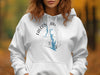 White hoodie with Falcon Lake, Texas map and compass design.