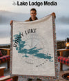 Woven throw blanket featuring Rainy Lake Minnesota map design and compass rose.