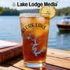 Glass of iced tea with a lemon slice and a lake map design.