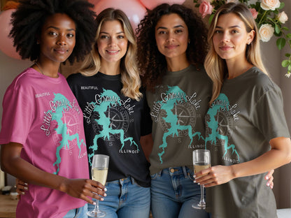 Four women wearing t-shirts with "Little Grassy Lake ILLINOIS" compass design.