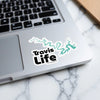 Travis Life sticker with teal lake outline on a laptop