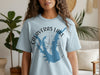 Light blue t-shirt featuring "Calaveras Lake Texas" graphic with compass and lake map.