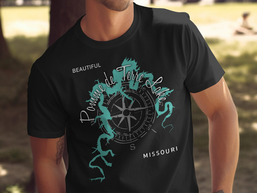 Black t-shirt with a teal compass graphic and "Pomme de Terre Lake Missouri" text.
