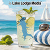 Glass with drink, lime, mint, and "INX LAKE" design on beach background.