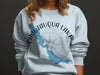 Light blue sweatshirt with Chautauqua Lake map and compass design.
