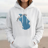 White hoodie on woman with Lake George Florida map and compass graphic.