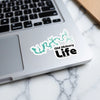 Teal Old Hickory Life sticker on a laptop keyboard.