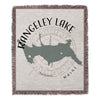 Woven throw with Rangeley Lake map, compass rose, and "Maine" text.