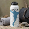 White water bottle with "CANYON" text and blue map shape, next to rolled towel and bag.