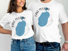 White t-shirts featuring a blue Lake Pulaski map graphic with text and compass rose.