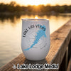 A white insulated tumbler featuring a blue outline map and text that reads Lake Las Vegas, Nevada.