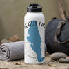 White water bottle with "Neesaut Lake" map and "Penns" text, beside a duffel bag.