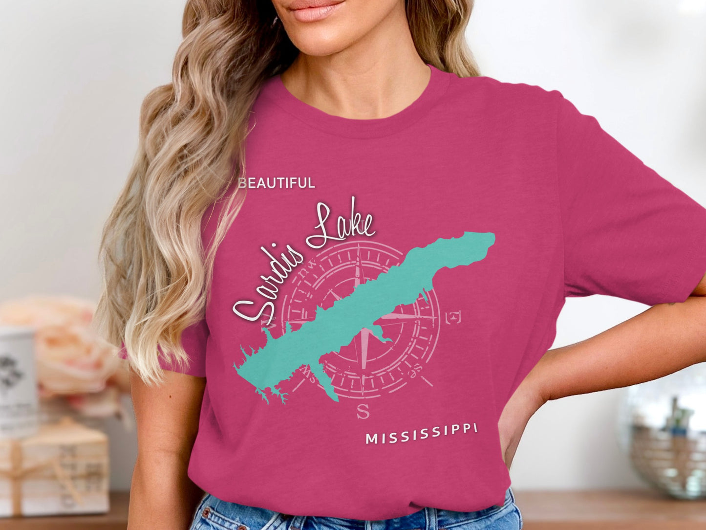 Pink t-shirt with a compass rose and the outline of Sardis Lake, Mississippi.