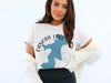 White t-shirt with round graphic reading "Canobie Lake Hampshire" and a blue lake outline.