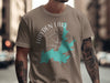 Taupe t-shirt with Hayden Lake map graphic, compass rose, and Idaho text.