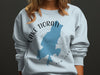 Light blue sweatshirt with Lake Tiorati New York map and compass graphic.