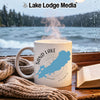White mug with Sand Lake Ontario map and compass on a rainy lake background.