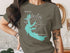Arkabutla Lake Mississippi on a dark green t-shirt with compass graphic.