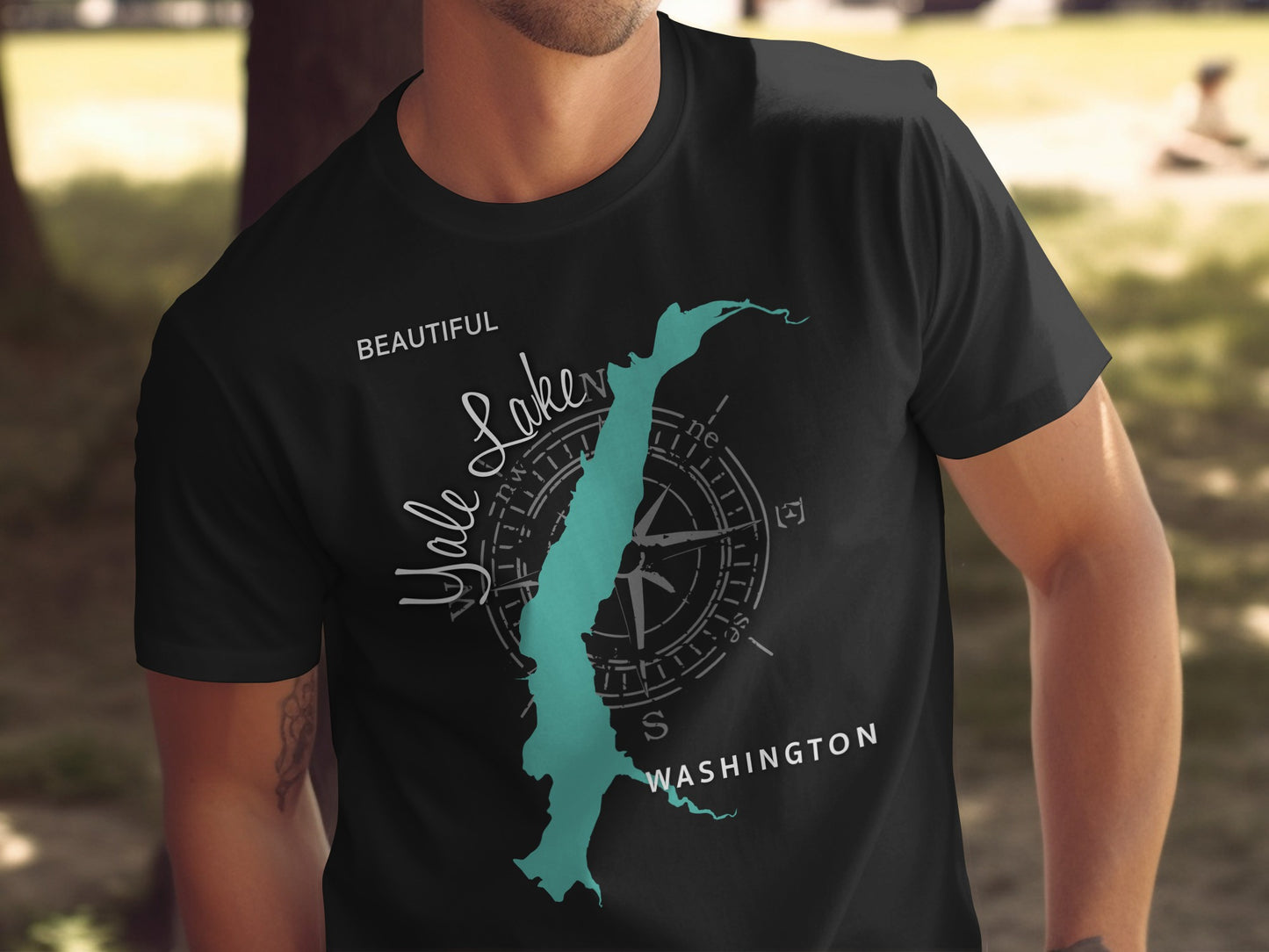 Black t-shirt with a turquoise outline of the state of Washington and "Lake Crescent" text.