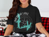 Black t-shirt with Medina Lake Texas map and compass graphic.