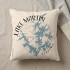 Cream pillow with Lake Martin Alabama map and compass graphic.