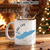 White mug with Lake Erie map and compass design, steaming coffee splashing.