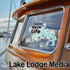 Table Rock Life sticker on a wooden boat window with Lake Lodge Media logo.