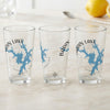 Three clear glasses with blue Badin Lake map and compass graphics.