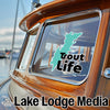 Sticker with turquoise lake outline and "Trout Life" text on a boat window.