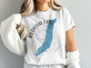 White t-shirt with Redfish Lake, Idaho design featuring a blue lake shape and compass