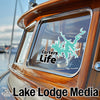 Teal lake outline sticker with "Carters Life" text on boat window, "Lake Lodge Media" text below.