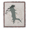 Woven throw featuring Lynx Lake silhouette, compass rose, and Arizona text.