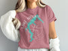 Pink t-shirt with turquoise Lake Jacomo map graphic and compass Rose graphic.