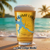 Beer glass with "Pequam Lake Minnesota" graphic on beach with ocean and palm trees.