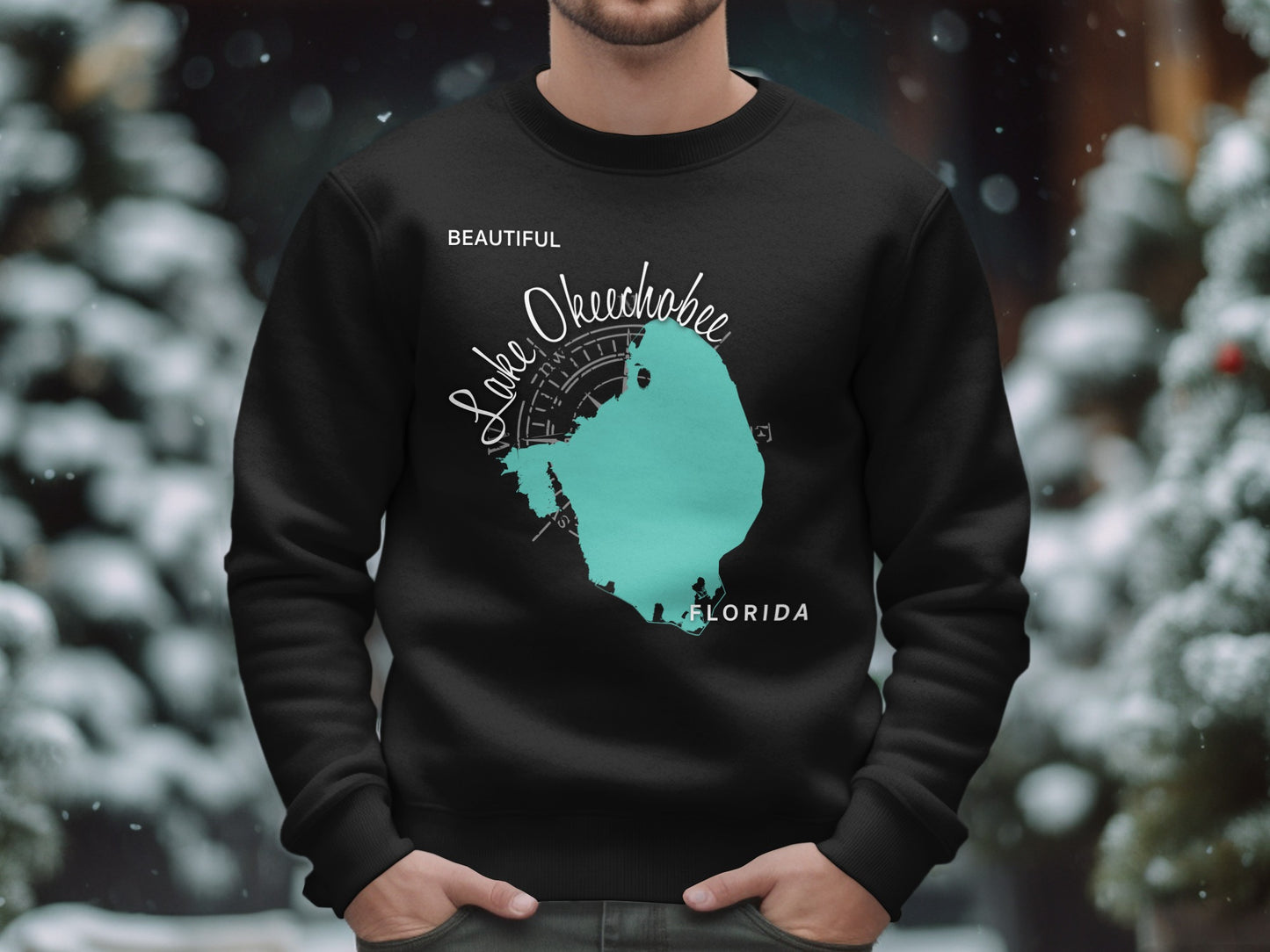 Black sweatshirt with teal Lake Okeechobee Florida map and compass graphic.