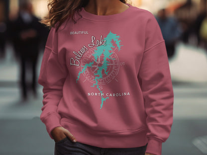 Pink sweatshirt with "Beautiful Belows Lake North Carolina" and compass design.