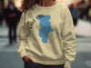 Light yellow crewneck sweatshirt with blue Lake Piru map and compass graphic.