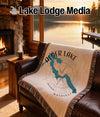 Woven blanket with Alder Lake Washington map and compass design.