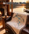 Burnsville Lake West Virginia map compass blanket on brown leather couch.