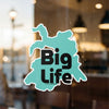 Teal sticker with black text "Big Life" and copyright Lake Lodge Media LLC.