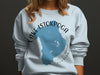 Light blue sweatshirt with a blue Lake Istokpoga map graphic and compass rose.
