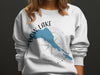 White sweatshirt with blue "Bow Lake Alberta" map and compass graphic.