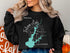 Black sweatshirt with Folsom Lake California map and compass graphic.