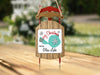 Wooden sled ornament with "Merry Christmas from Glen Lake" text and snowflake graphic.