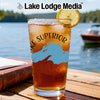 Iced tea in a glass with the Lake Superior map and "Lake Lodge Media" logo.