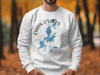 White sweatshirt with blue Chain O'Lakes Illinois map and compass design.