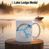White mug with Nantahala Lake map and compass design on a misty lake background.